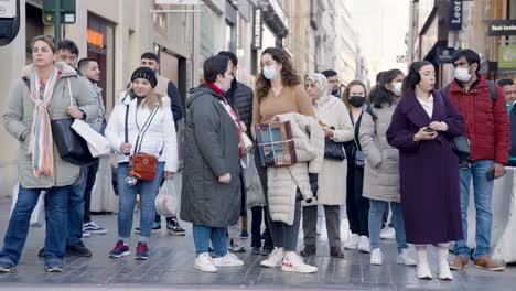 Multi-racial-people-waiting-downtown-at-crosswalk