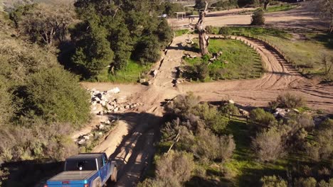 Off-roader-pick-up-truck-driving-on-extreme-course,-aerial-following-view