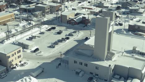 Aerial-Of-MICHI-NO-EKI-OMU-In-Snow-Covered-Town-In-Omu,-Hokkaido