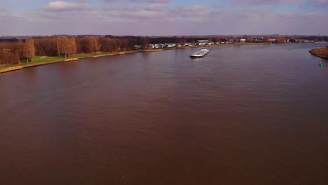 Aerial-Tracking-View-Of-Noordkaap-Inland-Liquid-Tanker-Approaching-On-Oude-Maas-In-Barendrecht