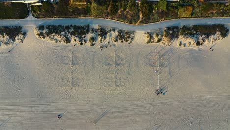 Top-View-Of-People-On-White-Sand-Beach-At-Summer