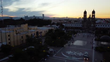 View-of-the-Basilica-of-Zapopan-at-sunset,-backwards-view
