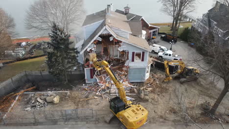 Aerial-footage-of-house-being-demolish,-Part-2-of-2