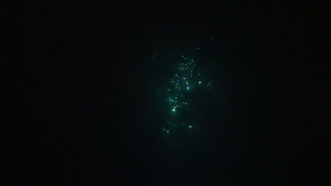 Light-sparkles-below-surface-at-night