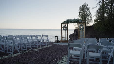 Cinematic-shot-of-a-wedding-ceremony-site-located-on-the-shoreline