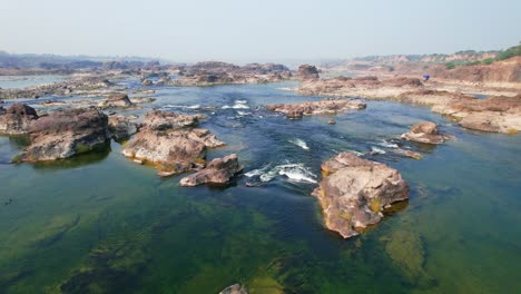 Beautiful-natural-scenery-of-river-in-Southeast-Asia-tropical-green-forest-with-mountains-in-the-background,-aerial-view-drone-shot