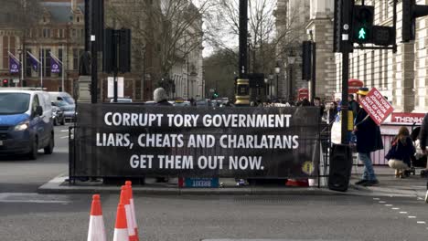 Corrupt-Tory-Government-Banner-Tied-To-Railings-On-Parliament-Street-On-17-March-2022