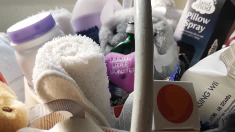 Mother-and-baby-shower-gift-basket-with-fluffy-plush-toys-and-motherhood-accessories