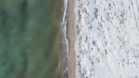 Buttery-soft-aerial-view-flight-bird's-eye-view-drone-footage-of-the-coastline-and-waves-at-natural-sand-Bouka-Beach-at-Corfu-Greece-is-a-travel-paradis-4k-Cinematic-view-from-above-by-Philipp-Marnitz