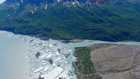 Flying-over-the-Lake-Fork-Knik-River-outlet-in-a-small-plane,-east-of-Palmer,-Alaska