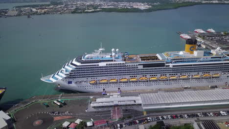 Aerial-view-of-the-side-of-Costa-Pacifica-cruise-ship-docked-in-the-port-of-Pointe-à-Pitre,-Guadeloupe