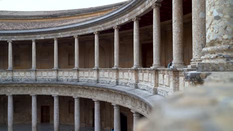 People-exploring-Henry-V-Palace-inside-Alhambra-in-Granada