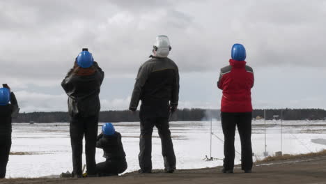 Research-team-watches-small-rocket-take-off,-slow-motion