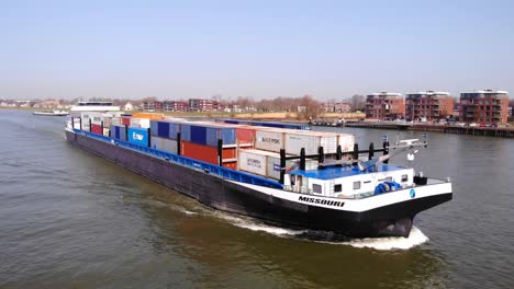 Missouri-Ship-Carrying-Shipping-Containers-Along-River-Noord