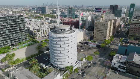 High-Above-Hollywood,-Drone-Shot-Over-Capitol-Records-Iconic-Building-in-Los-Angeles
