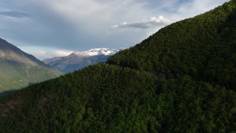 Establishing-Aerial-Drone-Shot-Revealing-the-Beautiful-Southern-Italian-Alps-Snow-Capped-Peaks