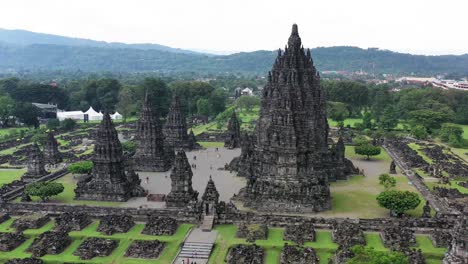 The-massive-Prambanan-Hindu-temple-in-Yogyakarta,-Indonesia-on-overcast-day,-Aerial-pedestal-pan-right-shot