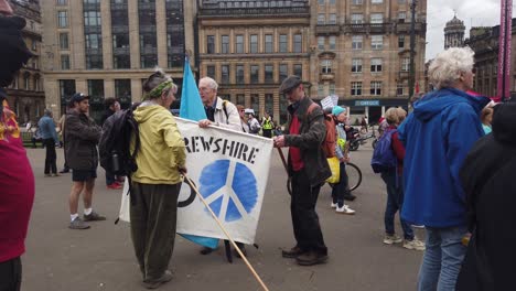 Protesters-putting-a-peace-banner-away