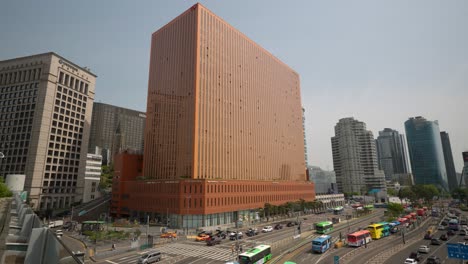 Seoul-Square-Building-and-Busy-Buses-Traveling-by-The-Central-Station-in-city-Downtown-daytime