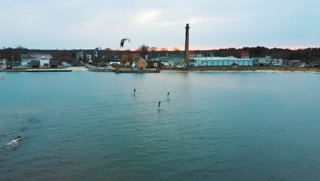 Engure,-Latvia,-23-May-2022:-Aerial-Drone-View-of-a-Corekites-Kitesurfers-Hydrofoiling-in-Engure-Port-at-in-Baltic-Sea