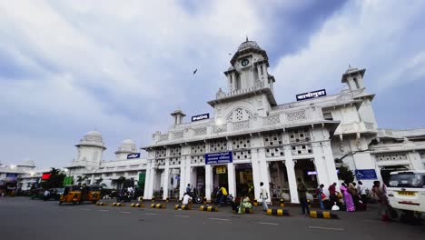 There-is-a-beautiful-white-railway-station-where-a-lot-of-people-are-moving