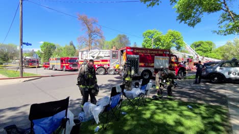 Firefighters-Go-Home-After-A-Fire-Is-Extinguished-On-A-Sunny-Day