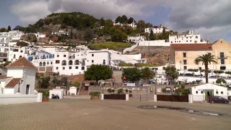 Left-slow-motion-pan-across-main-square-of-Frigiliana-village-in-Spain