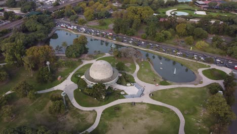 birds-eye-view-of-the-galileo-galilei-planetario-at-palermo-park-and-the-very-busy-highway-on-the-other-shore-of-the-lakes