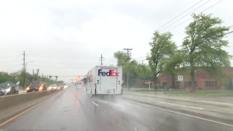 FedEx-Ground-driving-by-on-a-rainy-road