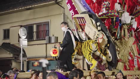 Omihachiman-Town-Officials-Riding-on-Sagicho-Matsuri-Mikoshi,-Year-of-Tiger