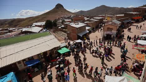 aerial-footage-of-the-traditional-tinku-dancers-on-a-square-of-the-village-o-uri-in-the-bolivian-andes-CITY:-Potossi-country-bolivia-date:May-11