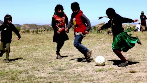 Children-in-the-rural-Andes-Mountains-of-Bolivia-playing-soccer-in-the-school-yard