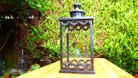 Decorative-gothic-black-metallic-lamp-on-garden-bench-pine-table-cheap-home-restoration