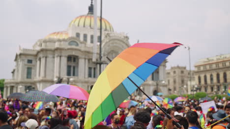 Large-Rainbow-Coloured-Umbrella-Being-Swung-At-Pride-Parade-Outside-Palacio-de-Bellas-Artes-In-Mexico-City-On-25-June-2022