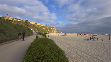 A-flock-of-birds-flying-over-Salt-creek-beach,-in-Dana-Point,-CA-slow-motion