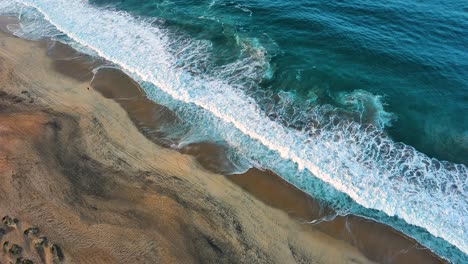 Aerial-Drone-Fly-Above-Blue-Waves-Shore-Pacific-Ocean-Beach-Puerto-Escondido