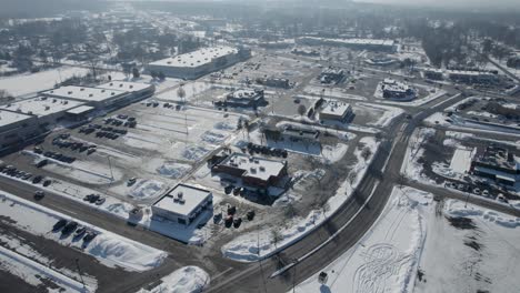 Aerial-view-of-beautiful-roads-and-buildings-covered-in-snow-during-winter-season