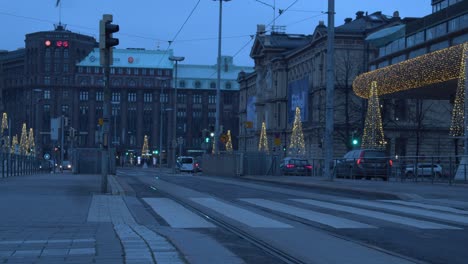 Nordic-blue-light-view-of-street-traffic-outside-museum-at-Christmas