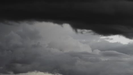 Time-lapse-of-rain-clouds-rolling-in-on-blue-sky