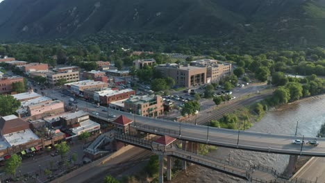 Aerial-view-of-the-Colorado-river-flowing-through-the-town-of-Glenwood-Springs,-Colorado