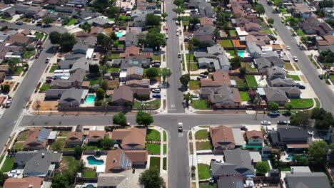 Typical-suburban-neighborhood-with-backyard-pools---aerial-flyover-of-Santa-Clarita-community