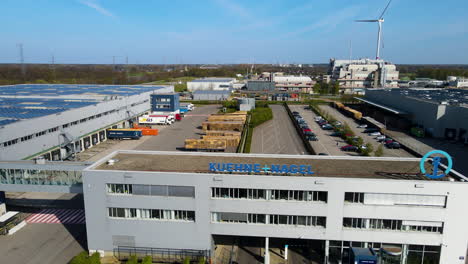 Aerial-of-logistics-office-of-Kuehne-Nagel,-one-of-the-largest-logistical-companies-in-the-world