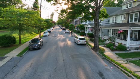 Moving-aerial-shot-of-small-town-street