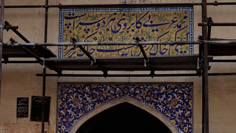 Video-of-Masjid-Wazir-Khan-mosque's-stunning-archway-gate-with-holy-verses-inscribed-on-it-in-Lahore,-Pakistan