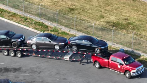 Pickup-truck-pulling-full-car-carrier-trailer