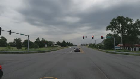 Traveling-in-the-Chicago-Illinois-area,-suburbs,-streets,-and-highways-in-POV-mode-red-cement-truck