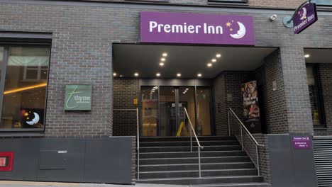 City-of-London-England-September-2022-Pan-right-establishing-shot-of-Premier-inn-entrance