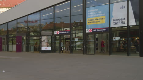 People-are-waiting-for-public-transport-vehicles,-Hungary,-Budapest,-downtown,-Szell-Kalman-Square-,-Metro-station-entrance