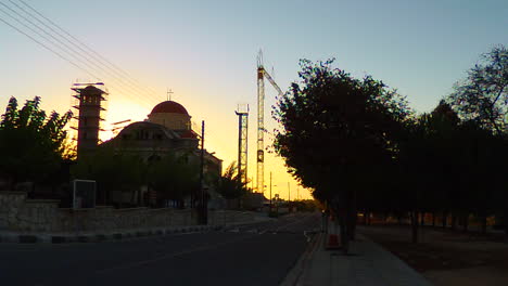 An-early-morning-clip-of-a-Church,-worker's-arriving-to-start-construction