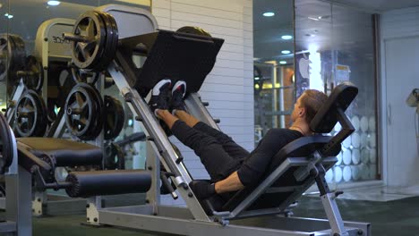 Performing-Calf-Leg-Press--exercise-at-the-gym